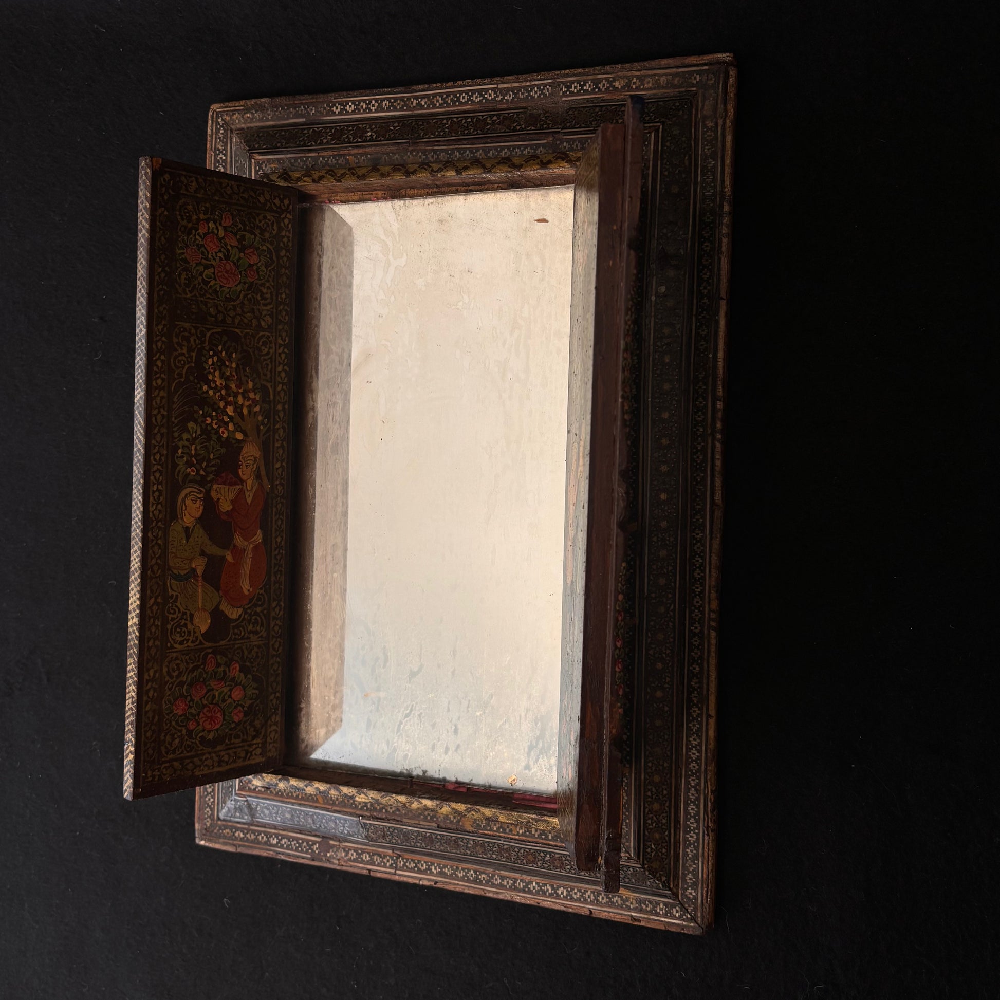 Persian Khatamkari mirror opened showing aged mirror plate and painted interior door