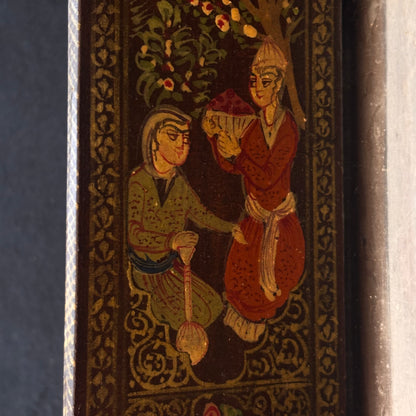Close-up of hand-painted Persian courtly figures on mirror door