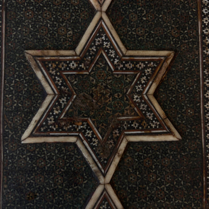 Close-up of reverse star motif with historic wear and losses