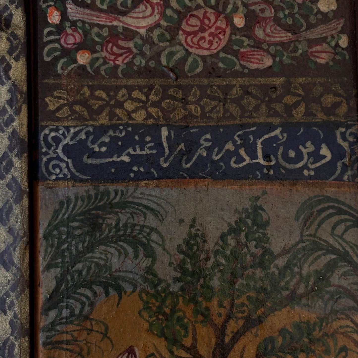 Front view of Persian Khatamkari mirror with painted hinged doors and floral decoration