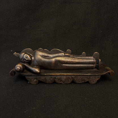 Early 20th century Sri Lankan bronze Parinirvana Buddha reclining on decorative couch