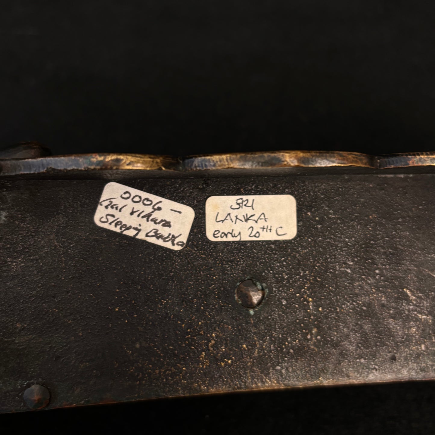 Underside of Sri Lankan bronze Buddha with old dealer's label